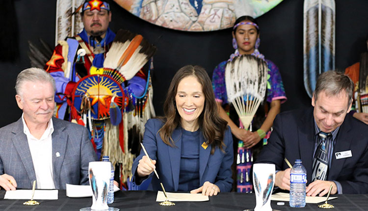 Some executives signing document